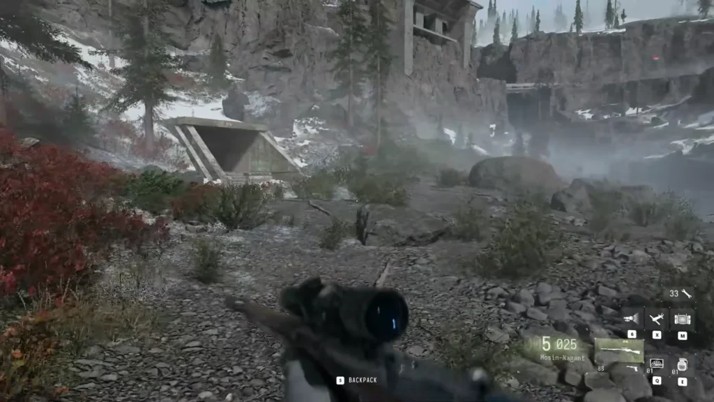 Island Hidden Bunker entrance tucked against a rocky cliff in Modern Warfare 4